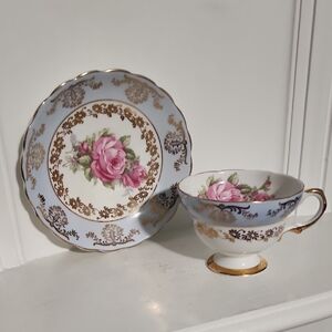 This is a vintage Queens English bone china teacup and saucer set England